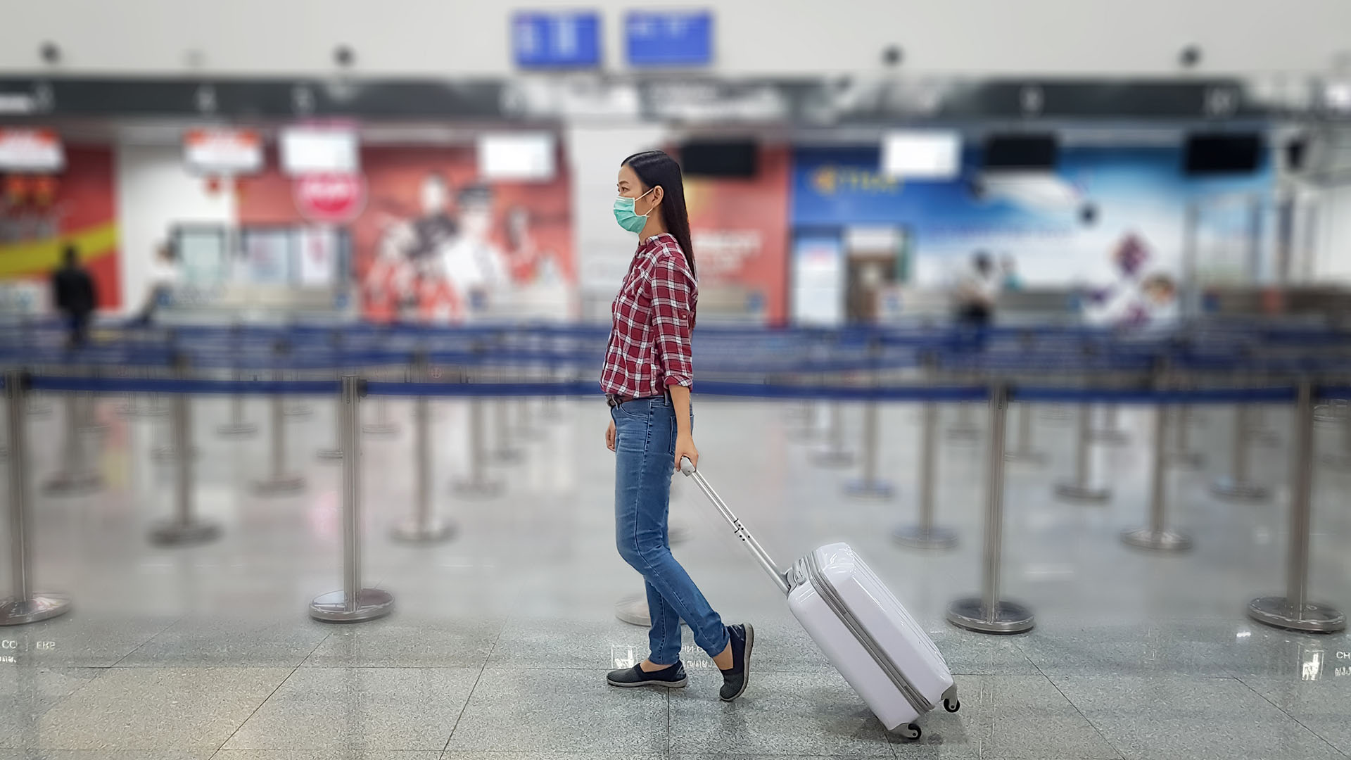 Person Walking Through Sanitized Airport